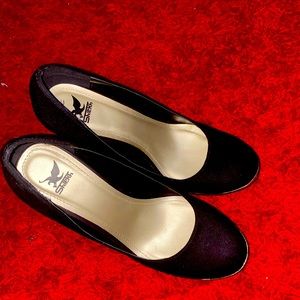 Gold heel black pumps